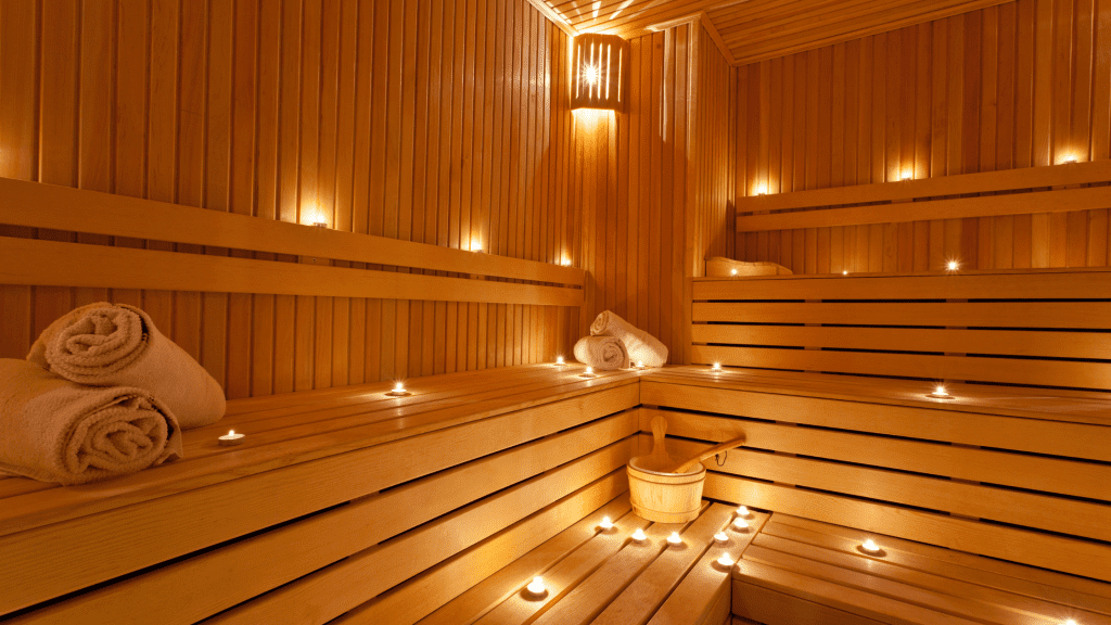 warm lit two-person sauna interior with wooden benches