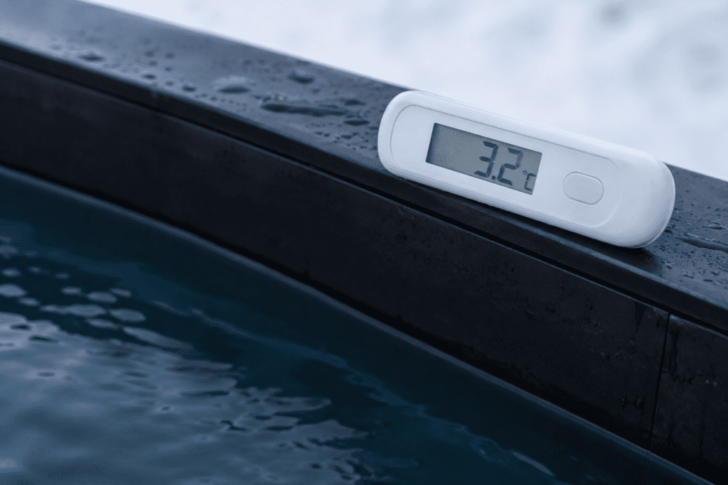 heart risks and cold exposure - thermometer on cold plunge tub edge